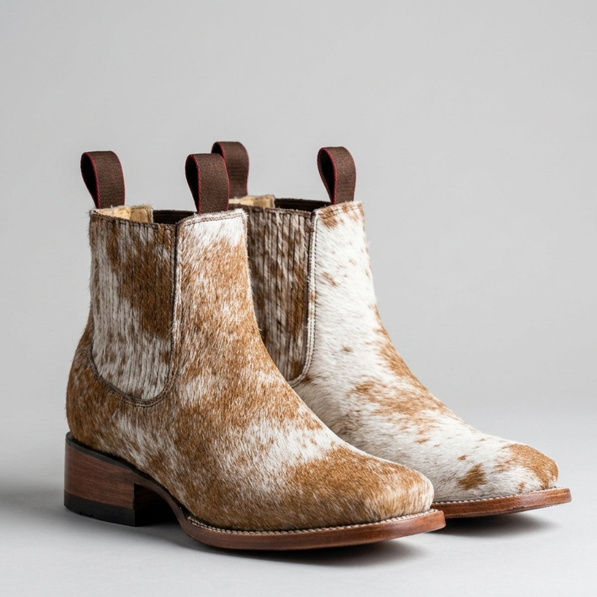 Lirac women's light brown hair-on hide square toe booties.