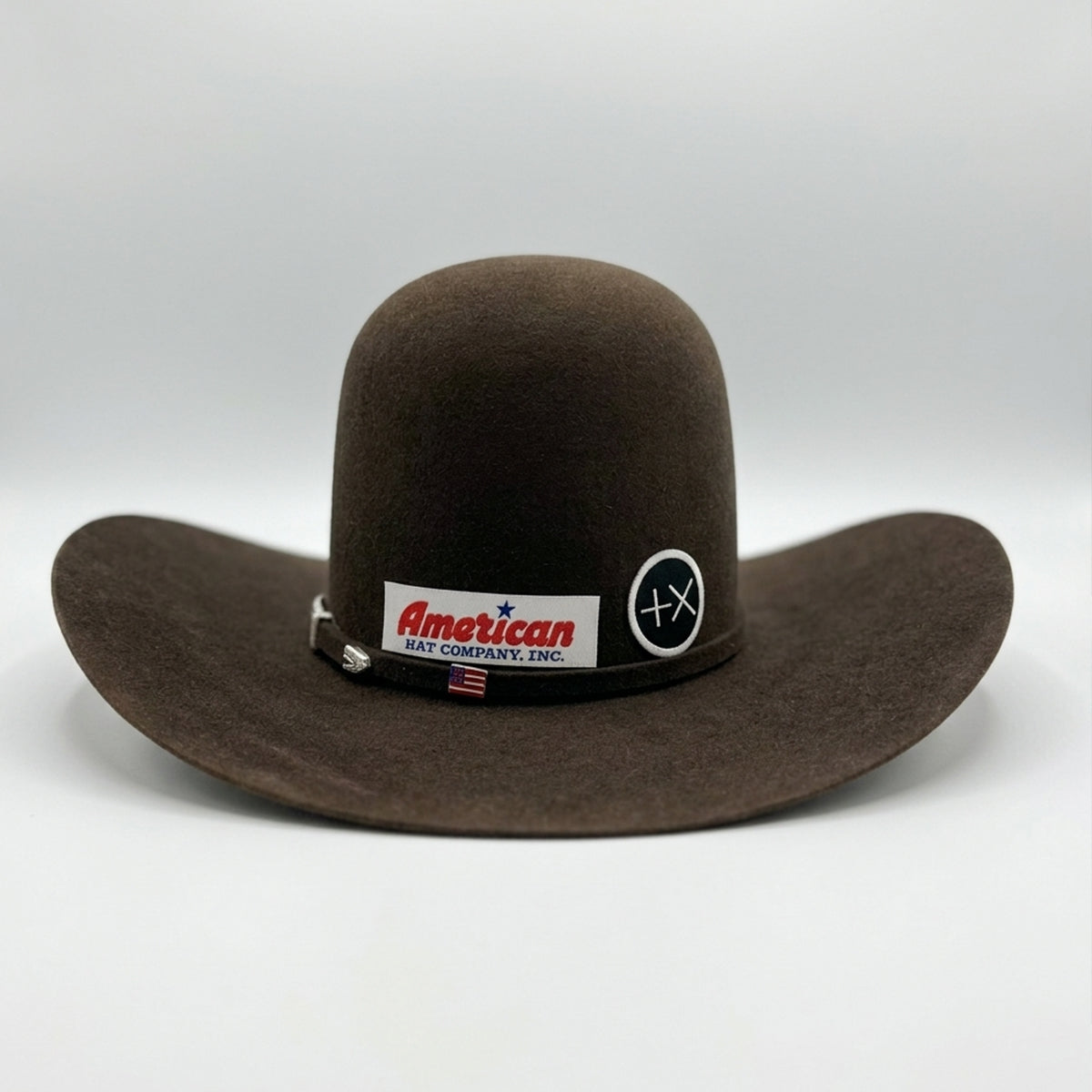 Back view of American Hat Co brown felt cowboy hat with a visible brand label on a white background.