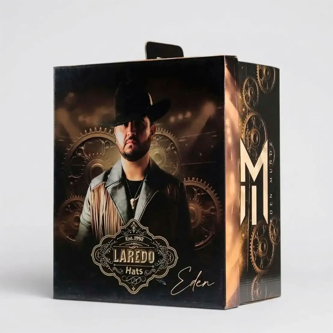Official graphic collector's hat box for the Laredo Hats Eden Muñoz signature series featuring portrait artwork and gold branding.