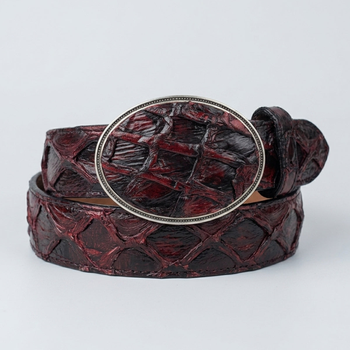 Los Altos men's black cherry genuine Pirarucu fish western belt with a silver buckle on a light gray background.