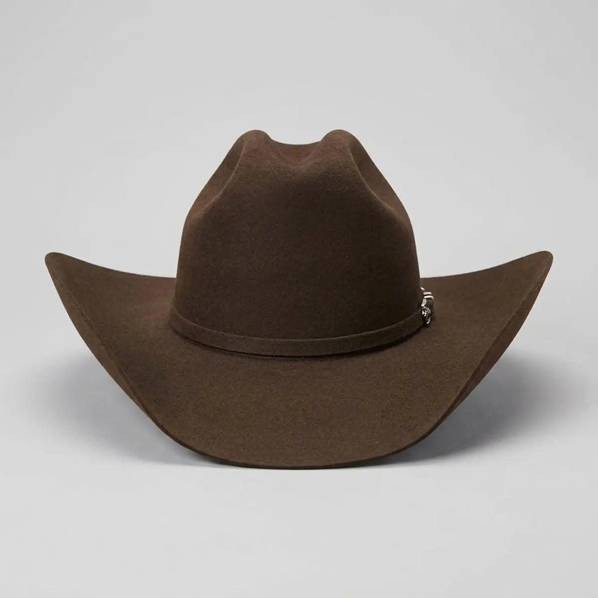 Straight-on front view of the Stetson Apache 4X mink buffalo felt cowboy hat showcasing the Cattleman crown crease, curved brim symmetry, and silver buckle accent.