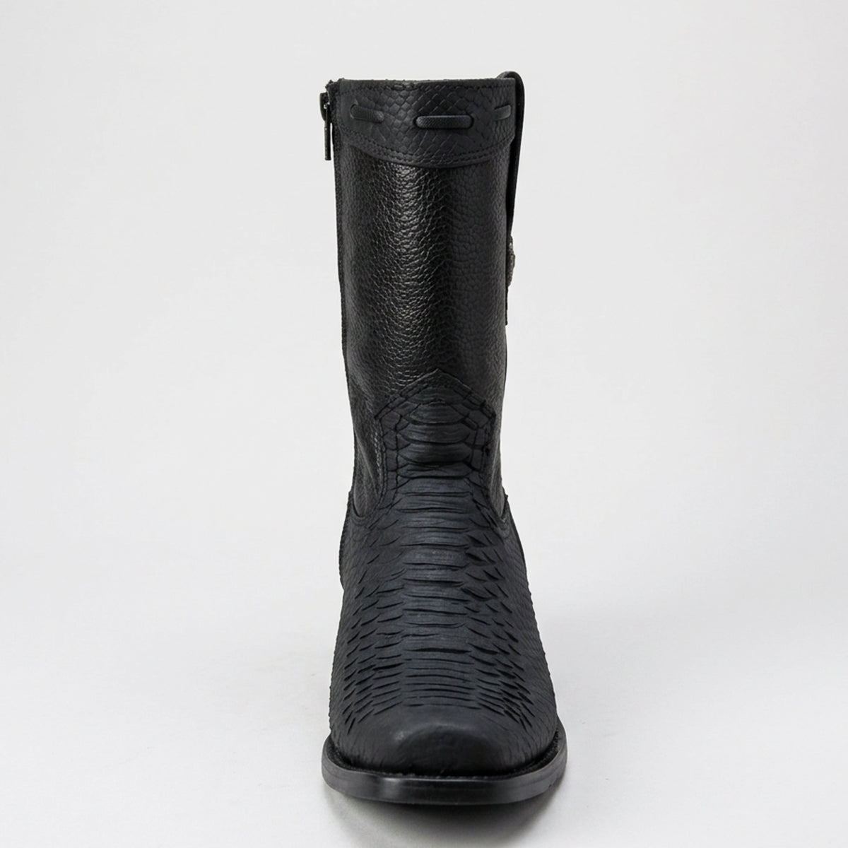 A single black leather ankle boot with a textured python-patterned lower section and a side zipper, shown from a front-facing perspective on a light gray background.