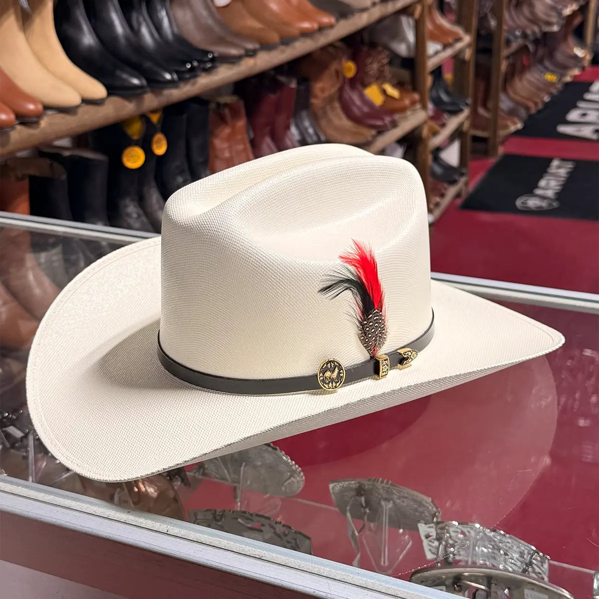 Interior studio view of the Abolengo 1000X straw cowboy hat revealing the custom satin crown lining with the printed rooster graphic and leather sweatband.