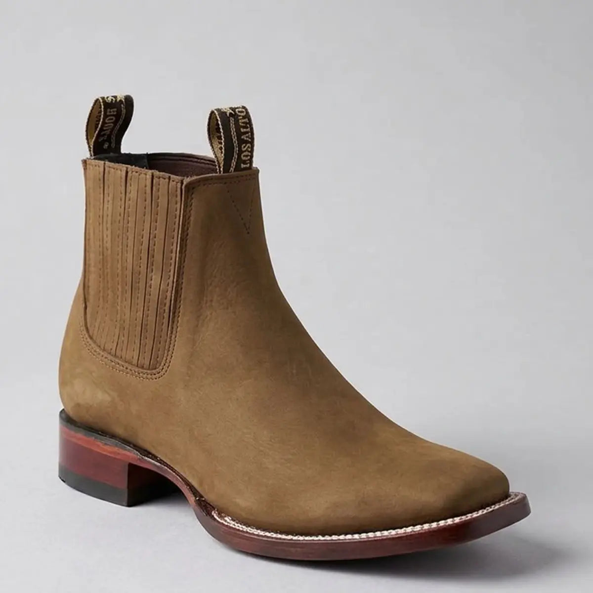 Single studio profile view of the Los Altos men's brown nubuck leather Chelsea square toe ankle boot displaying the elastic side goring and block heel.