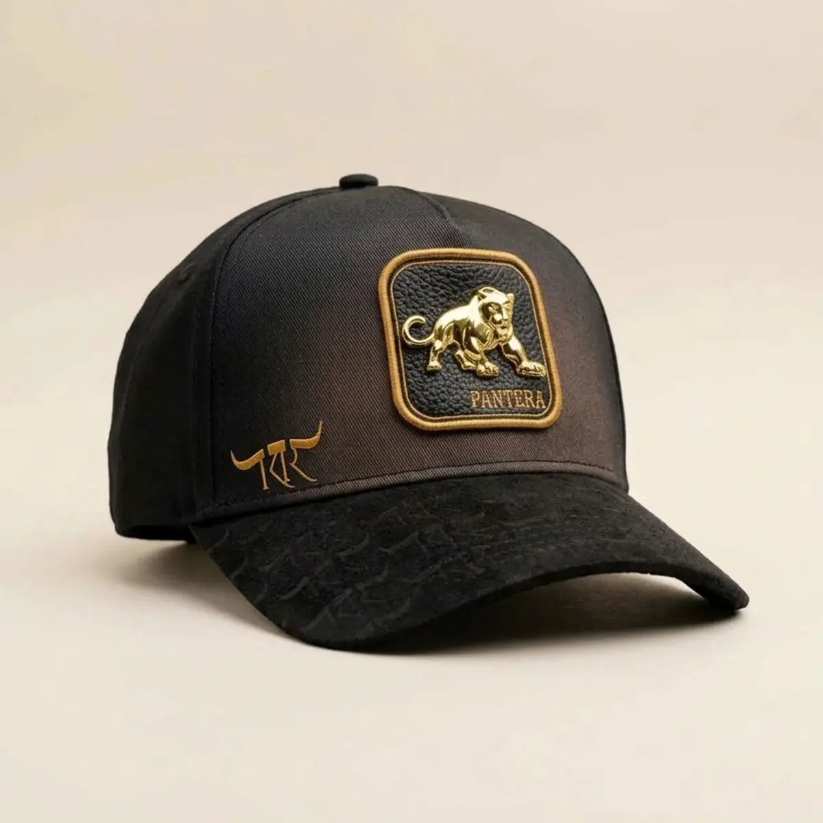Three-quarter side angle view of the King Ranch "Pantera" cap highlighting the structured crown, suede brim texture, and gold side logo.