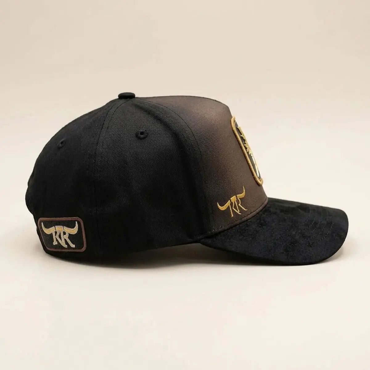 Full side angle view of The King Ranch "Perico" cap displaying the rear temple patch, mesh transition, and curved suede visor.