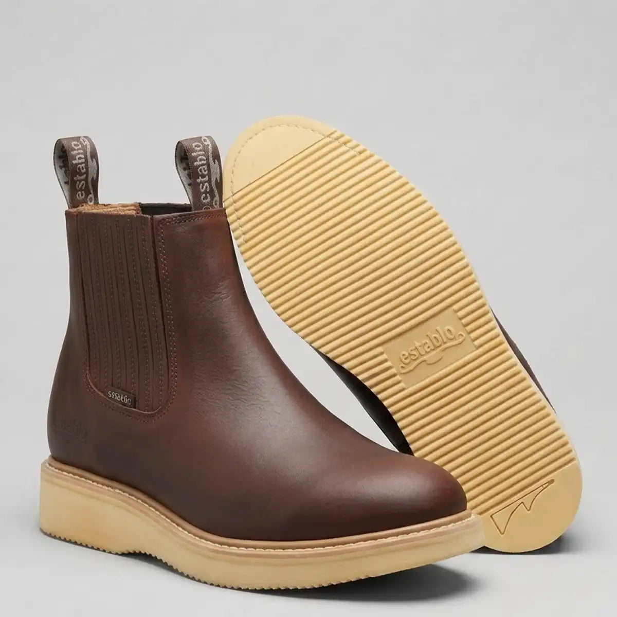 Bottom sole view of the Establo Men's work boot displaying the cream ribbed polyurethane wedge outsole.
