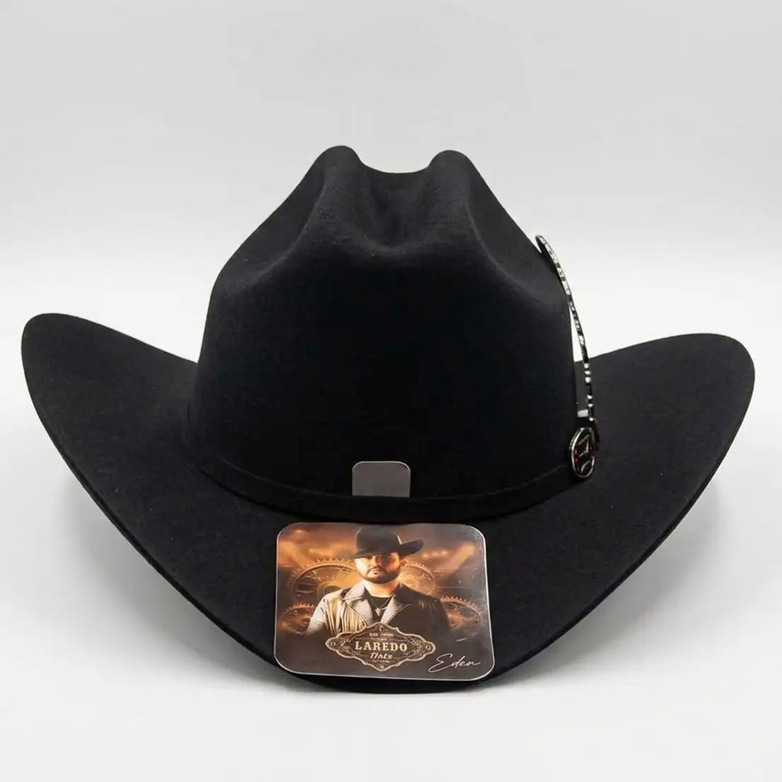 Straight front-facing view of the black Eden Muñoz tejana hat displaying the cattleman crown crease and side metallic feather accent.