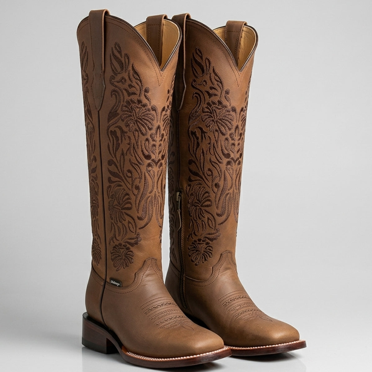 Botas Doble R women's Valencia 16-inch tall brown leather square toe cowgirl boots featuring dark tonal floral embroidery along the extended shaft.