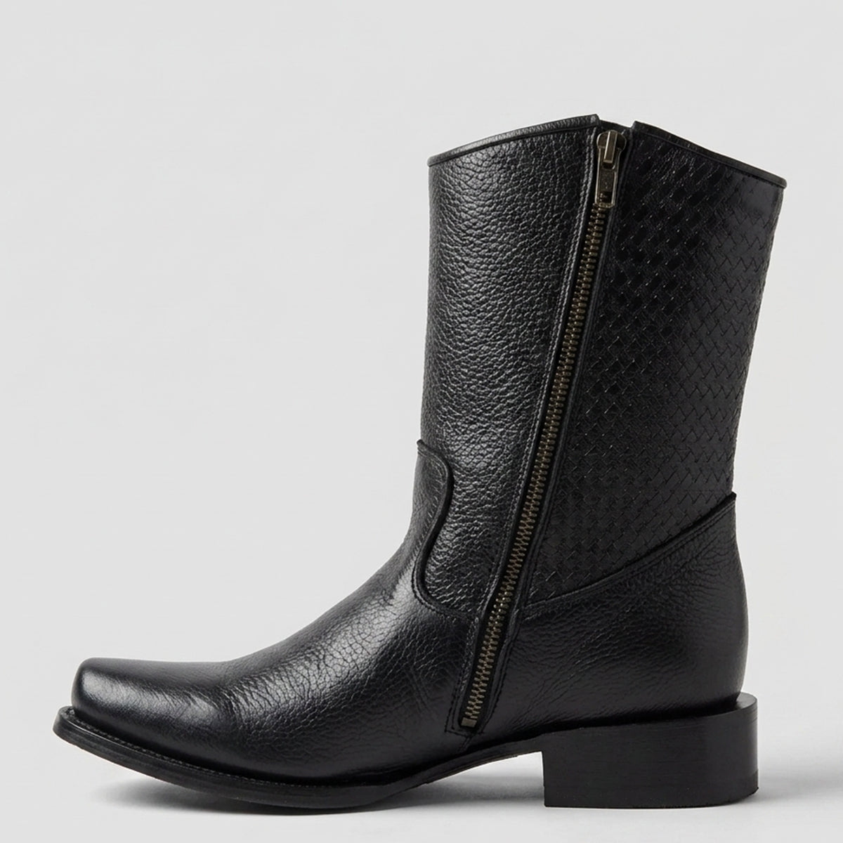 A black leather mid-calf men's western boot with a side zipper, textured grain shaft, and low block heel, shown against a light gray background.