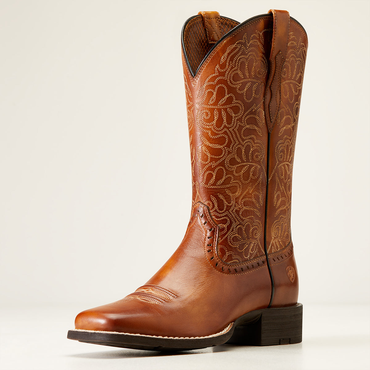 Ariat Women's Round Up Remuda Naturally Rich full-grain leather Cowboy boot featuring a wide square toe, ornate floral shaft stitching, and horseman heel.
