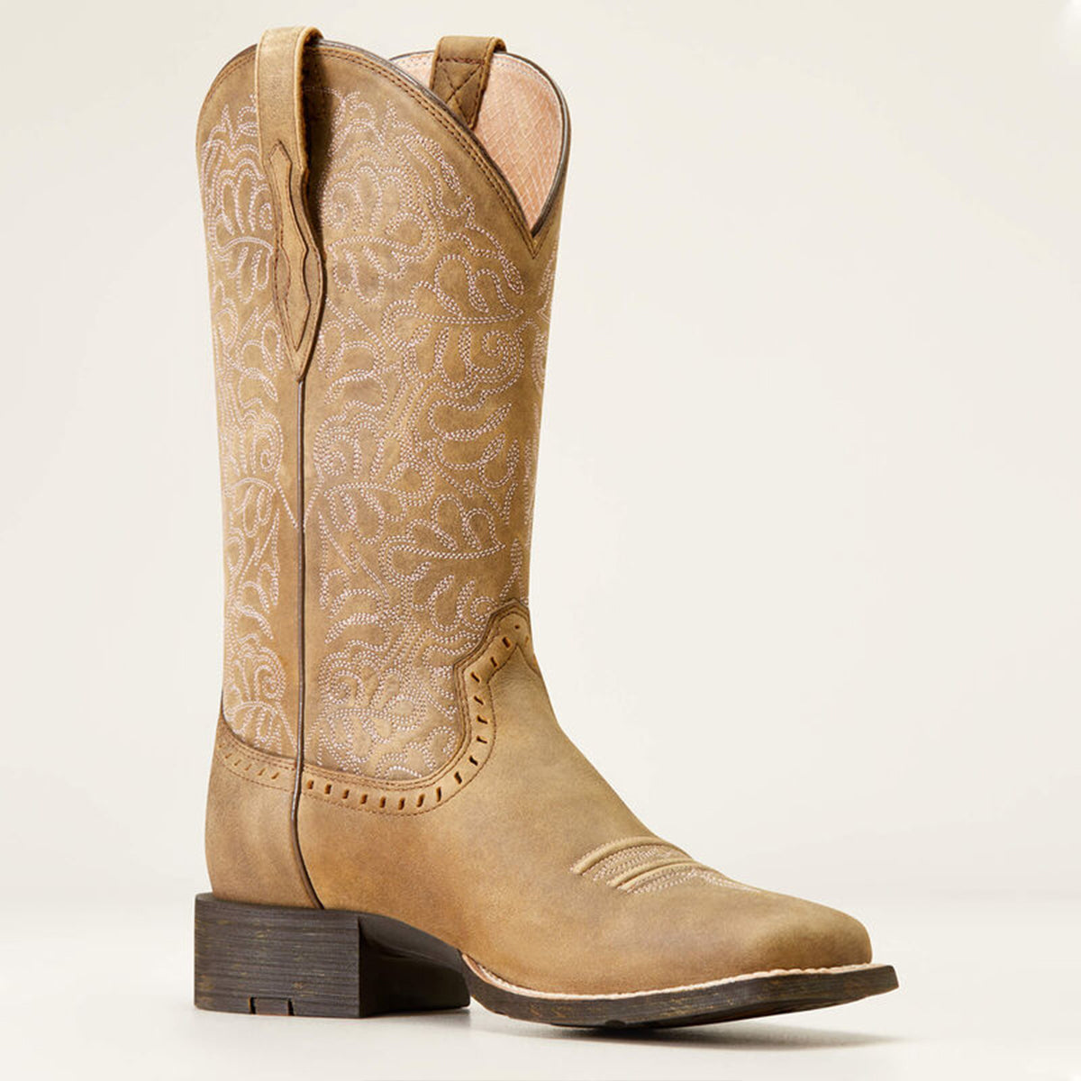 Ariat women's tan square toe cowboy boot with intricate patterns on a white background.