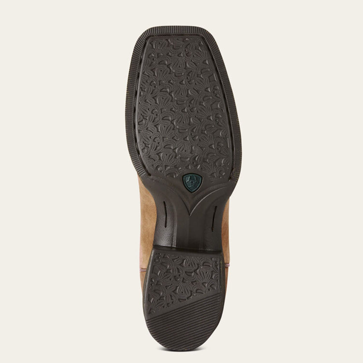 Close-up of a sole with a patterned tread design on a light gray background.