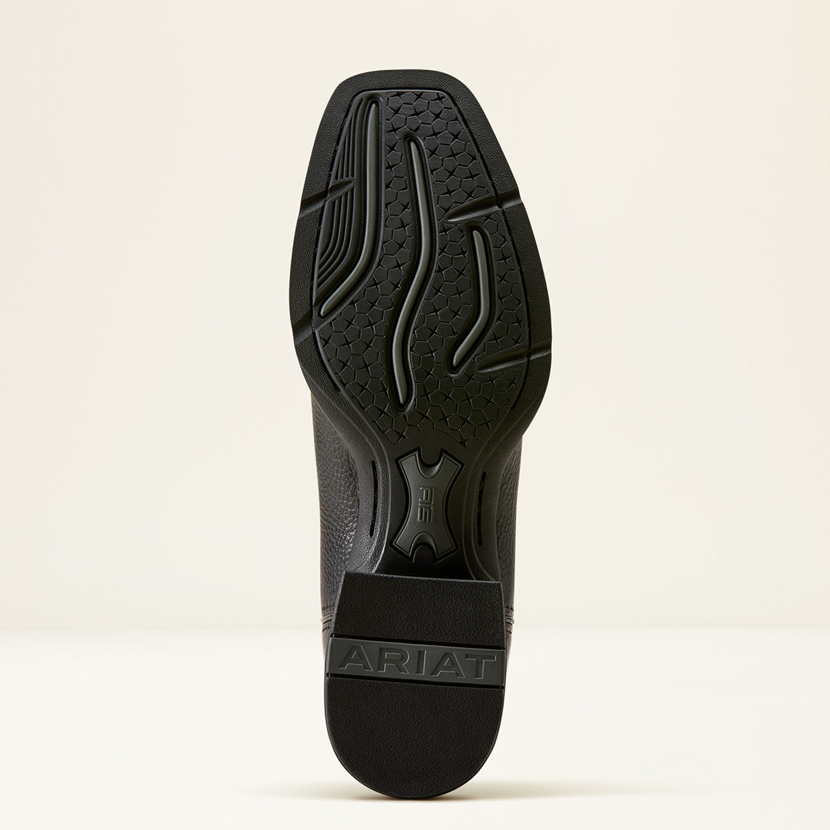 The outsole of a black Ariat boot shown from a top-down view against a clean, off-white background.