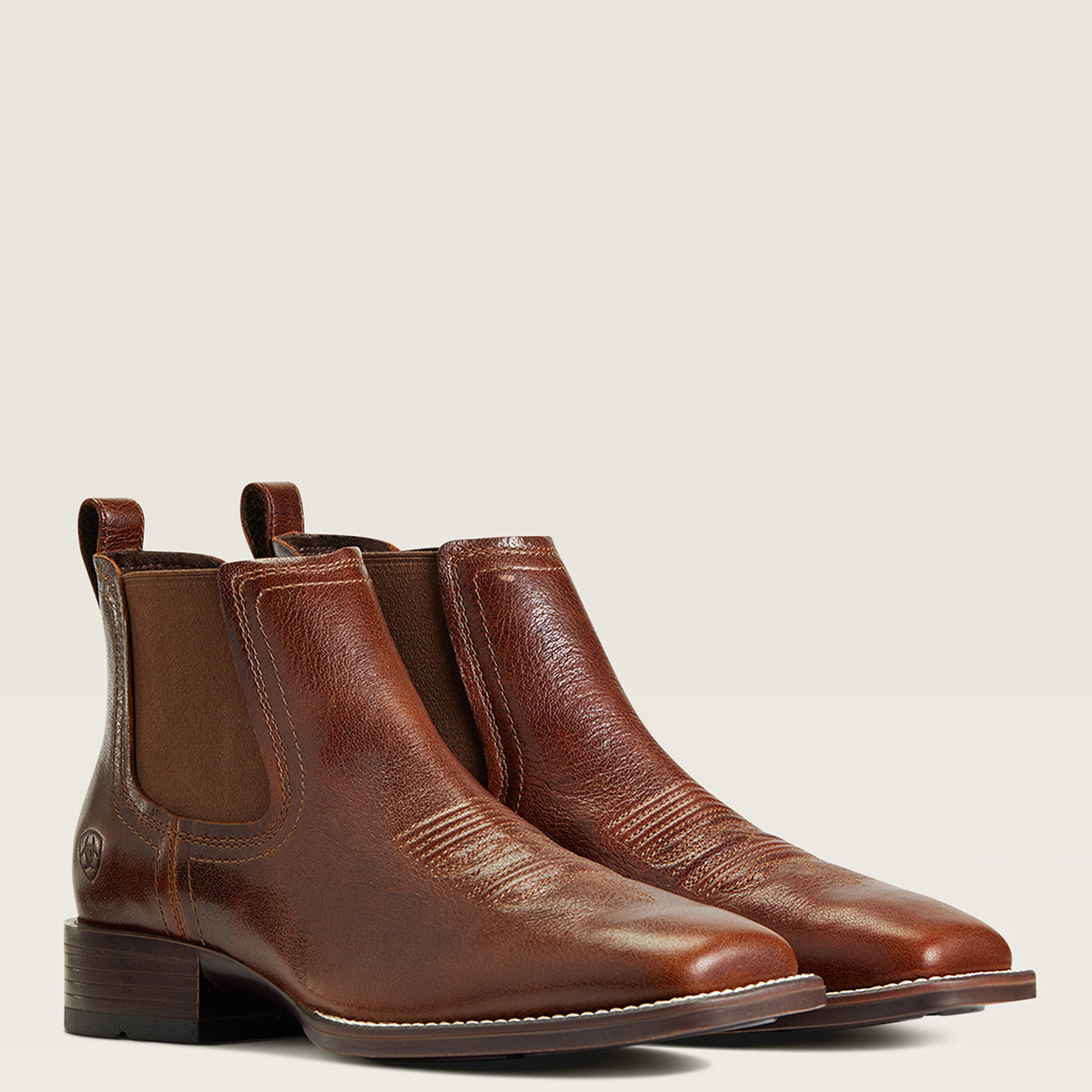 Ariat Men’s Booker Bantamweight Royal Brown Ankle western Boots in full-grain leather with broad square toes, elastic side panels, and double-stitched welts.