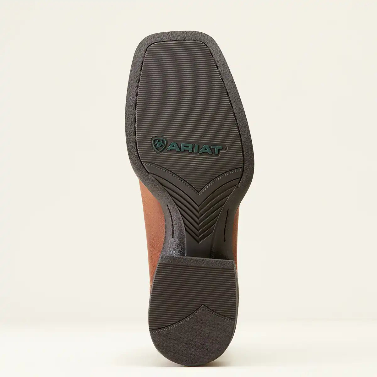 The outsole of a brown leather boot with a dark gray treaded sole, featuring the embossed Ariat logo, shown against a light off-white background.