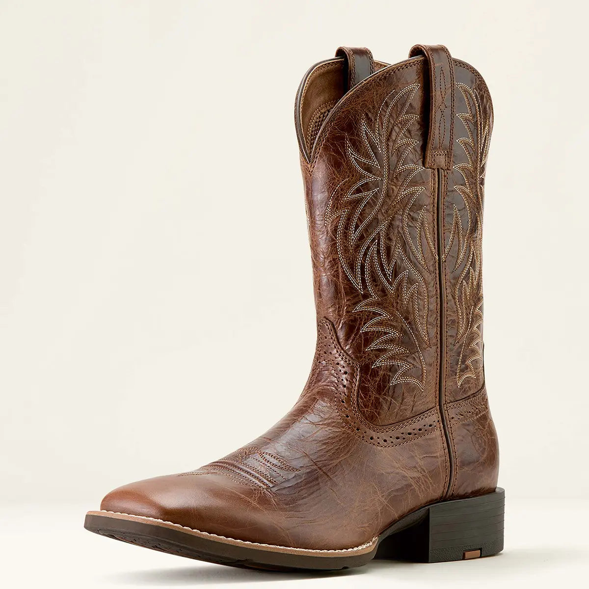 Three-quarter front studio view of the Ariat men's Sport Western dark tan cowboy boot highlighting the wide square toe profile and upper leather stitching.