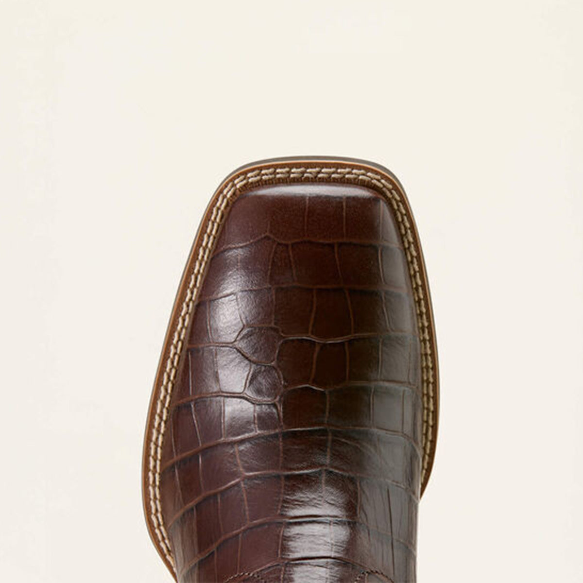 close up of Ariat brown crocodile print square toe.