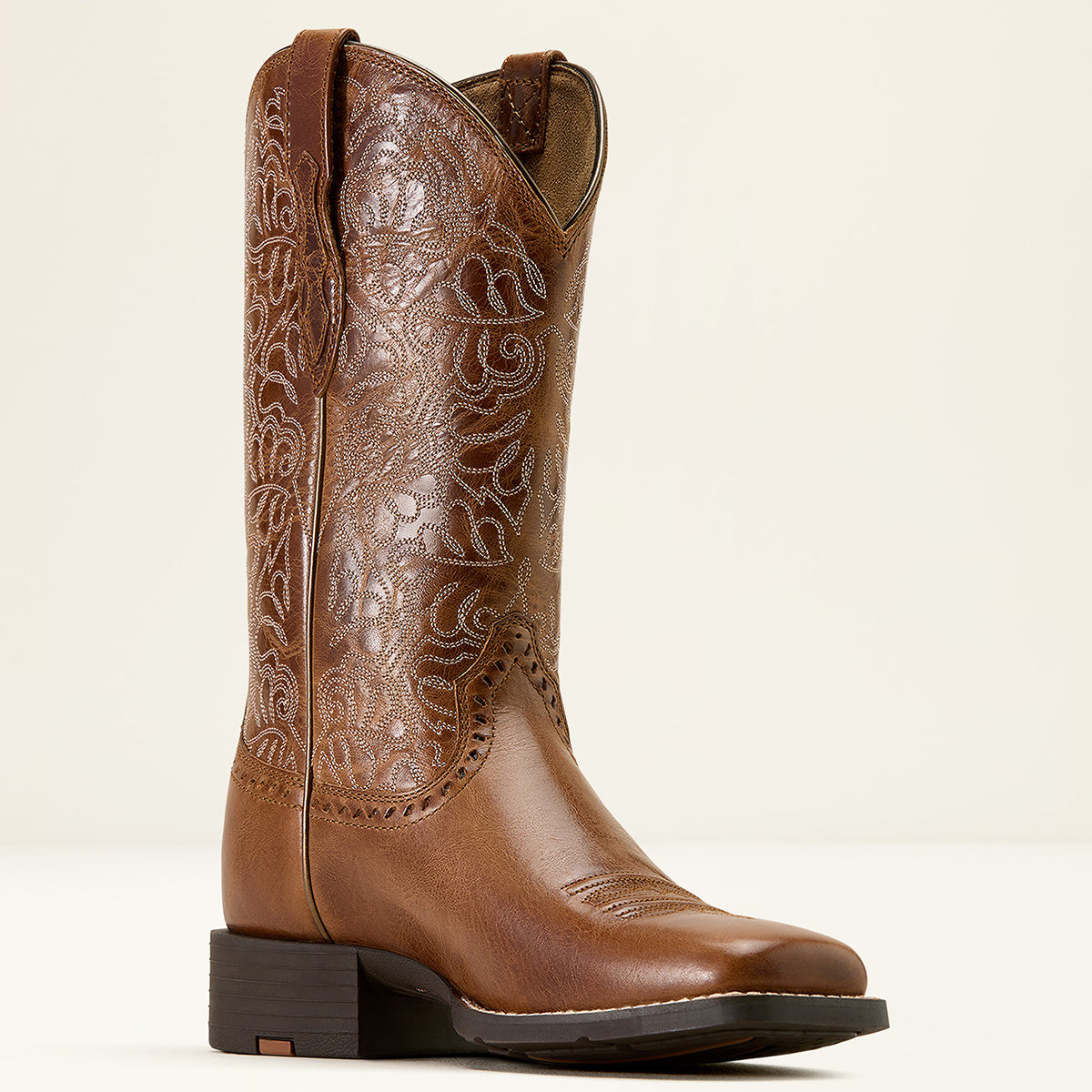Ariat Women’s Round Up Remuda Western Boot in Aged Tan leather featuring intricate cutwork-style embroidery on an 11-inch shaft and a wide square toe.