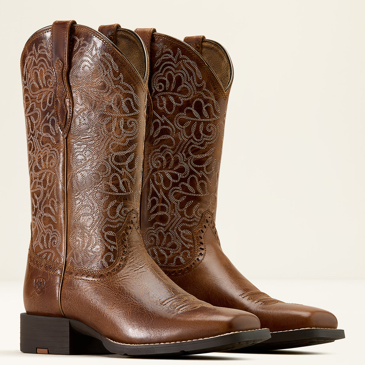 Ariat Women’s Round Up Remuda Western Boots in Aged Tan leather featuring intricate cutwork-style embroidery on an 11-inch shaft and a wide square toe.