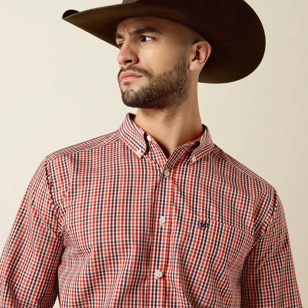 Close-up view of the inner collar on the Ariat Ketchup shirt displaying the Wrinkle-Free label and red micro-dot inner neckband.