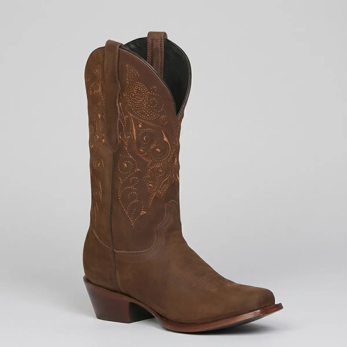 Studio profile view of the El General Women's camel brown nubuck leather square toe boot displaying the shaft embroidery, pull straps, and 2-inch Western heel.