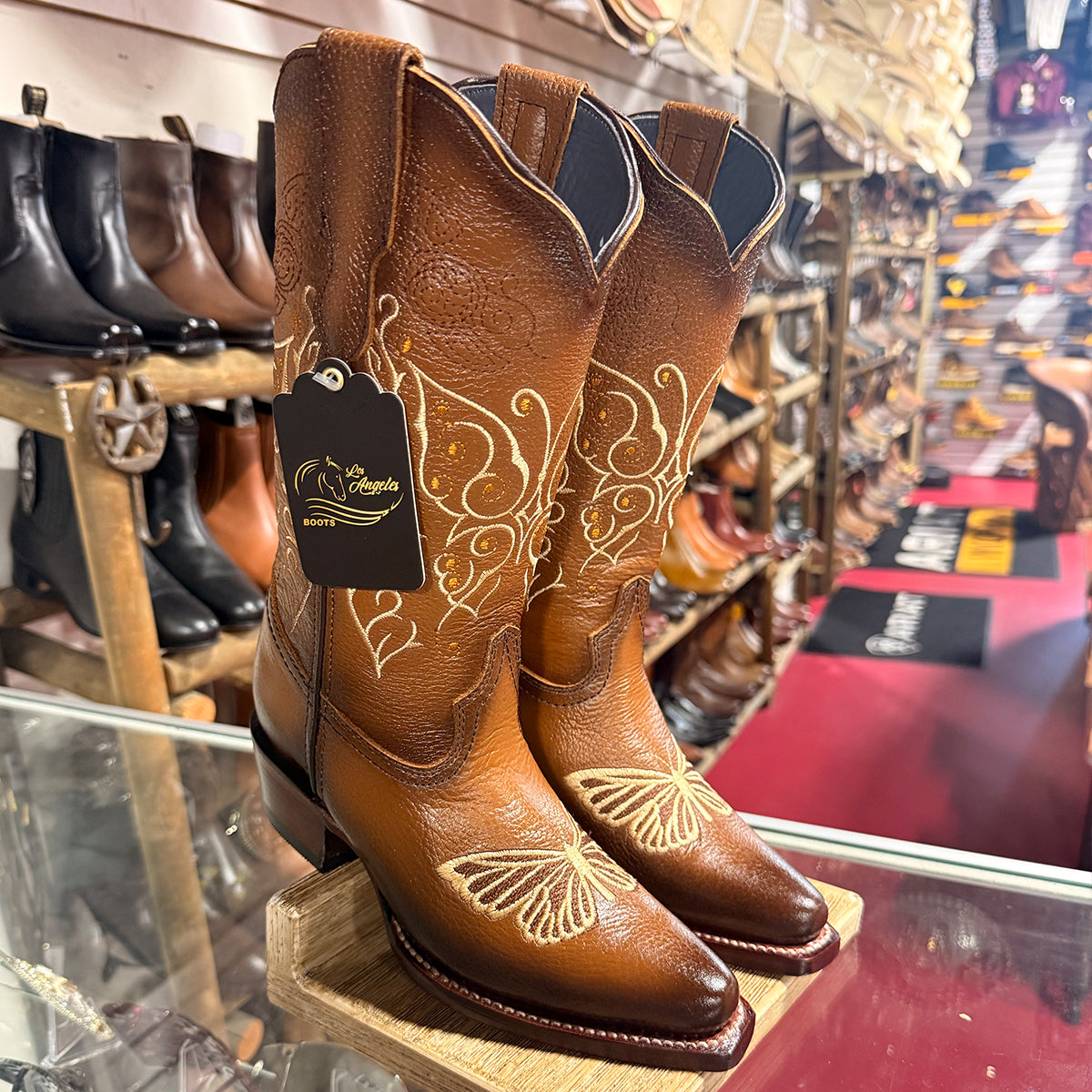 Los Angeles women's warm honey brown leather snip toe cowgirl boots featuring embroidered butterfly motifs with rhinestone details.