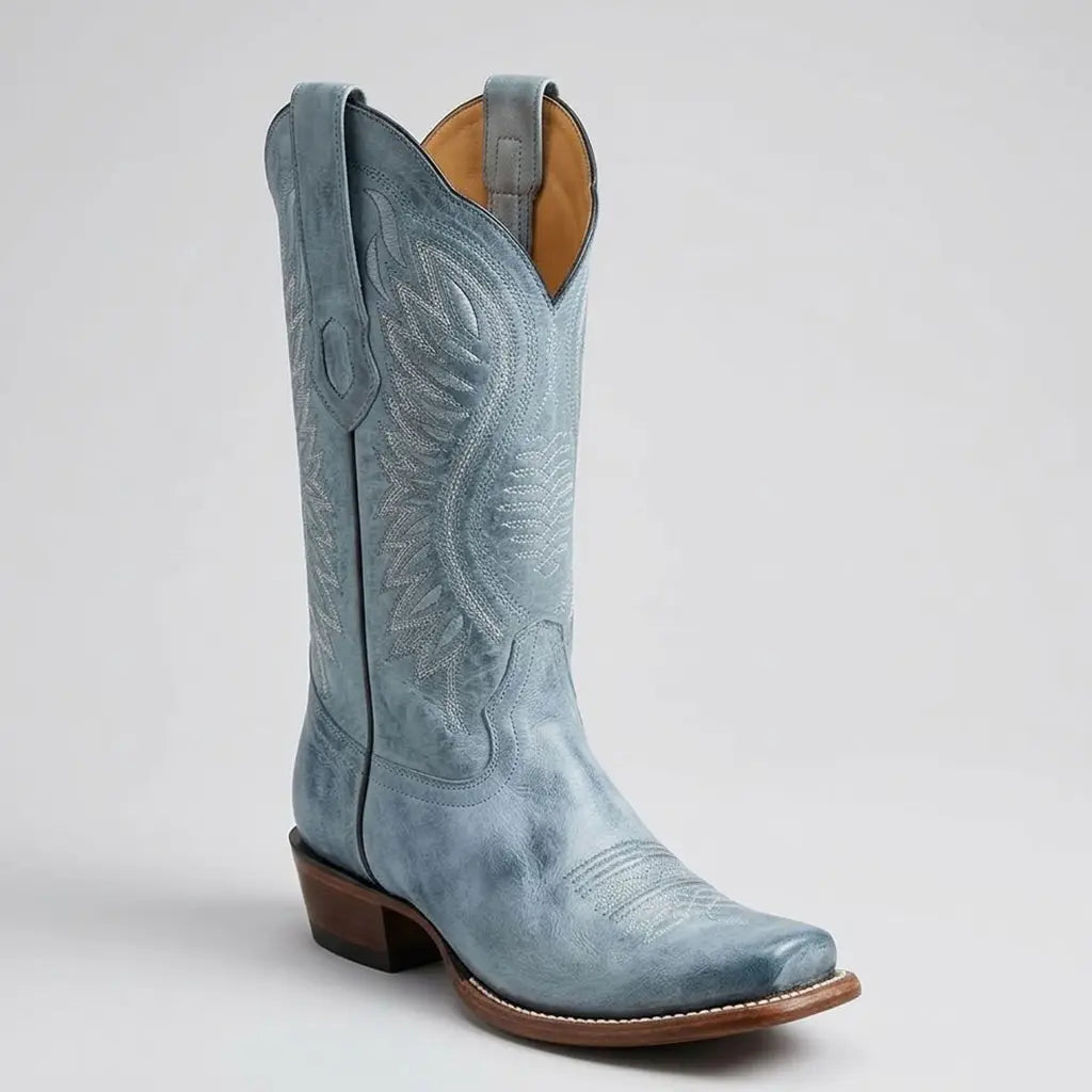 Three-quarter studio view of the Los Altos Women's vintage blue leather cowgirl boot displaying the distressed patina, cutter toe, and 12-inch stitched shaft.