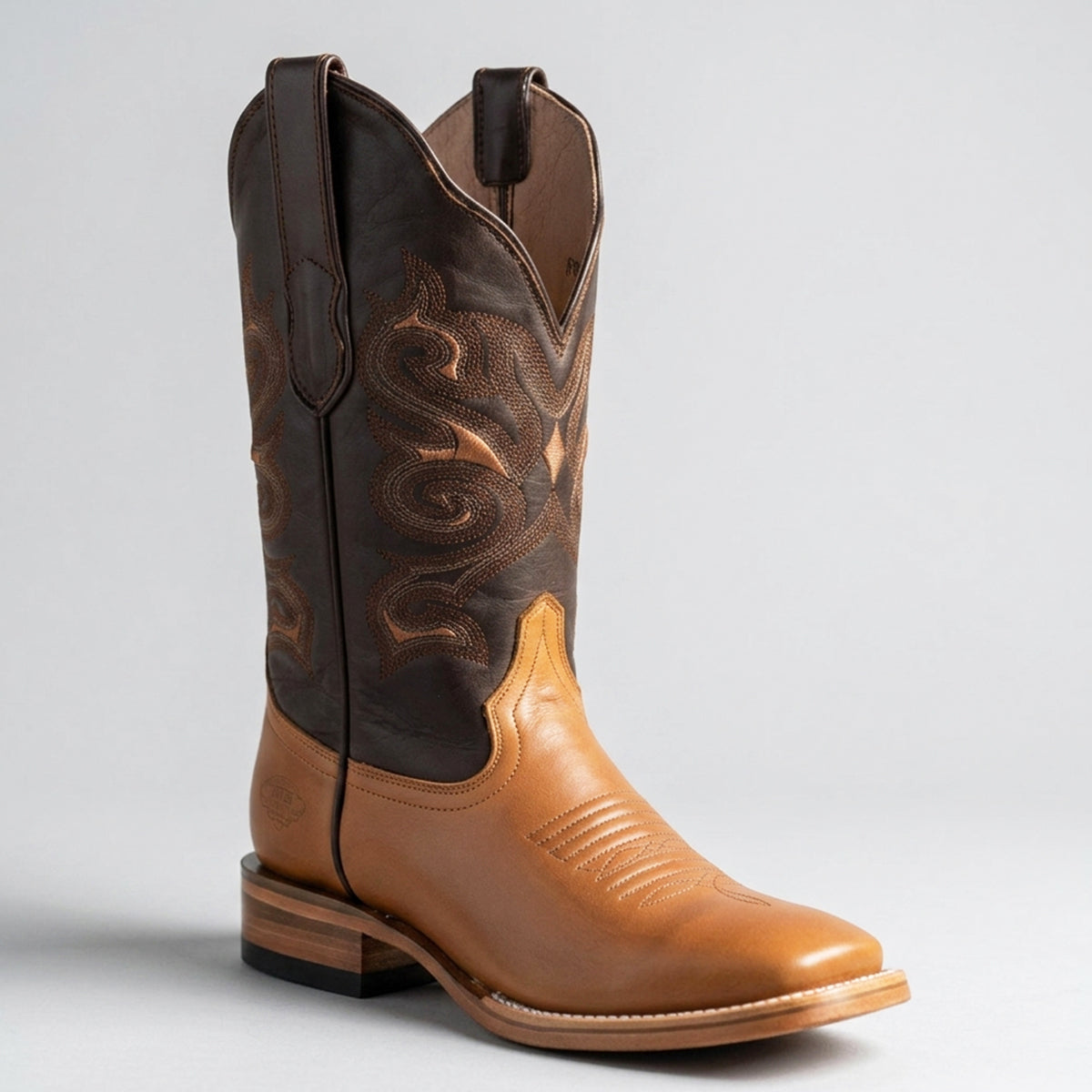 White Diamonds women's two-tone gold and dark brown square toe cowboy boots with stitched shaft.