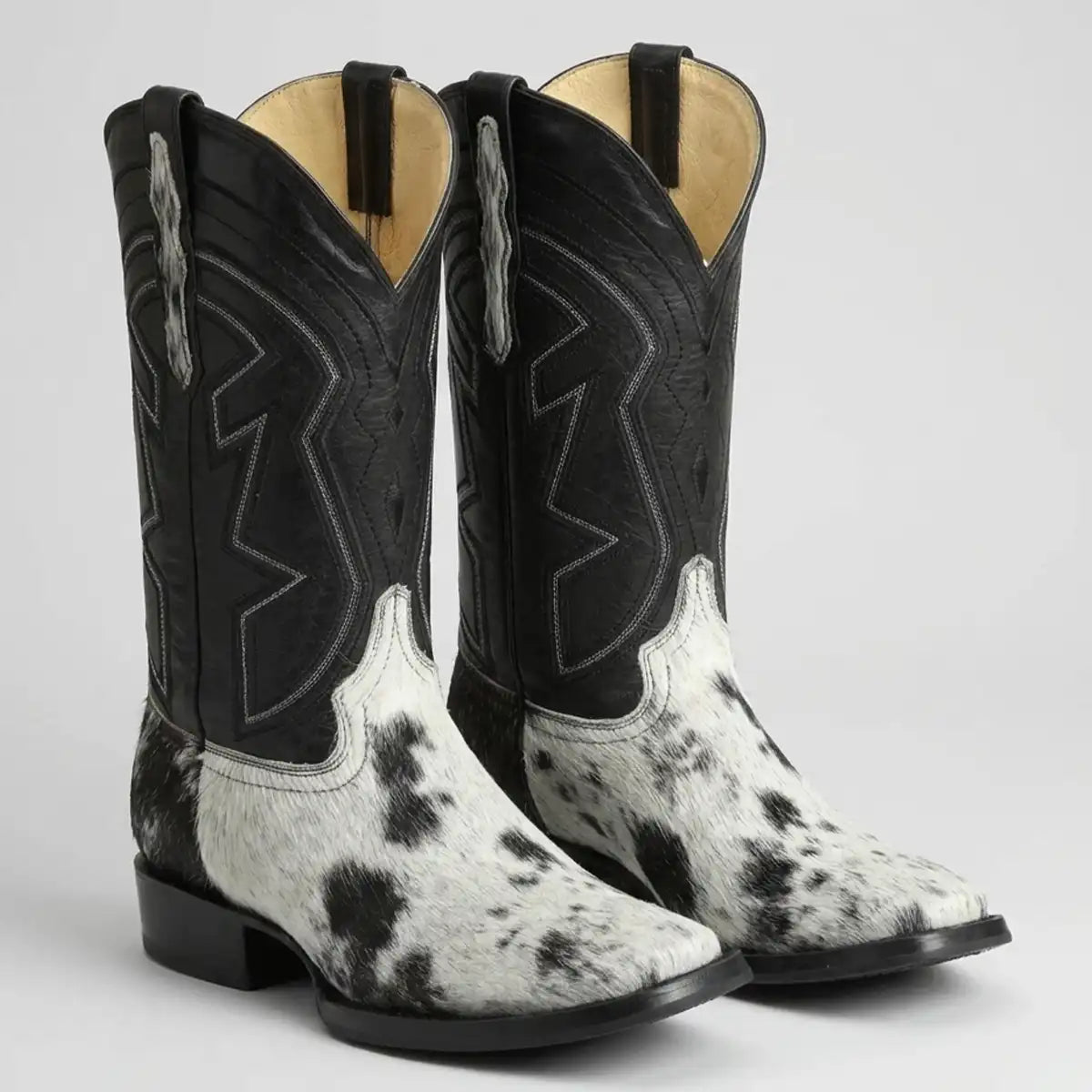 El General Men's black and white genuine hair-on cowhide cowboy boots with black leather shaft and square toe.