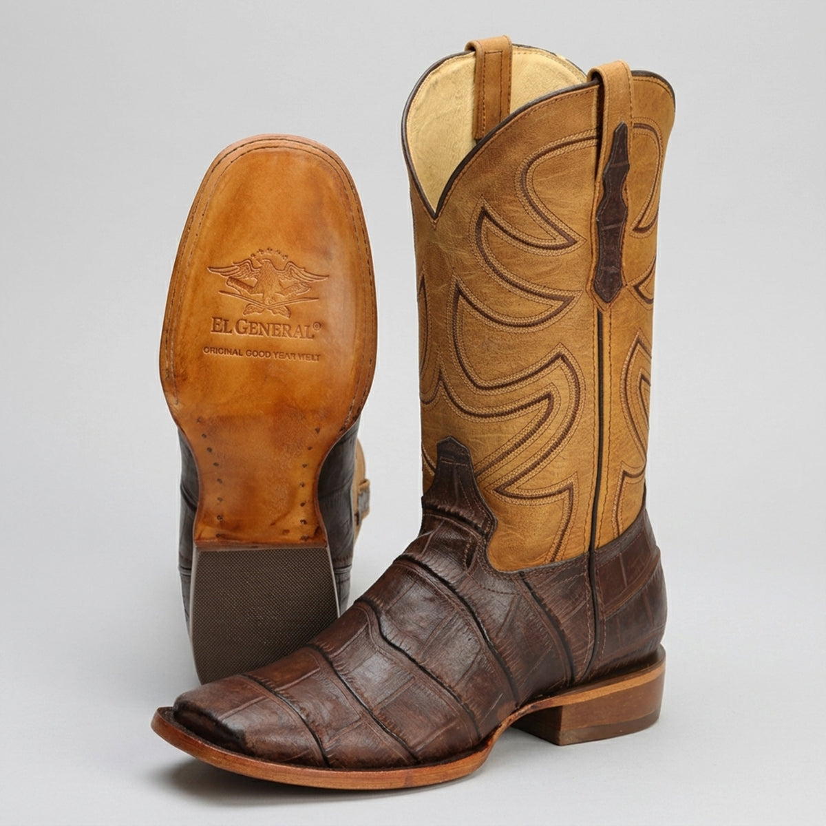 Pair of brown and tan square toe western boots with 'El General' branding on leather sole.