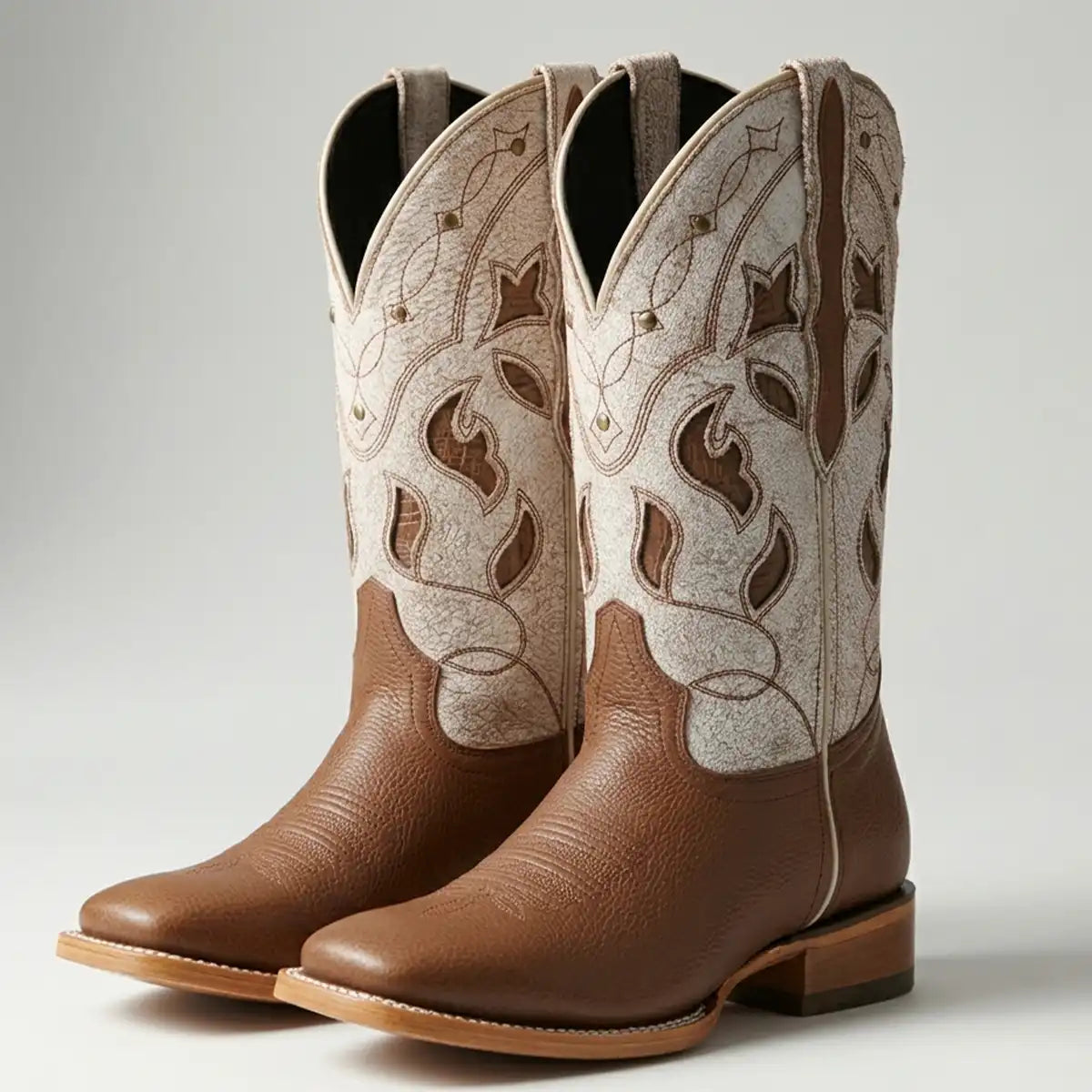 Pair of El General Women's Honey Brown Floter leather cowgirl boots with a bone-colored embroidered shaft and wide square toe.