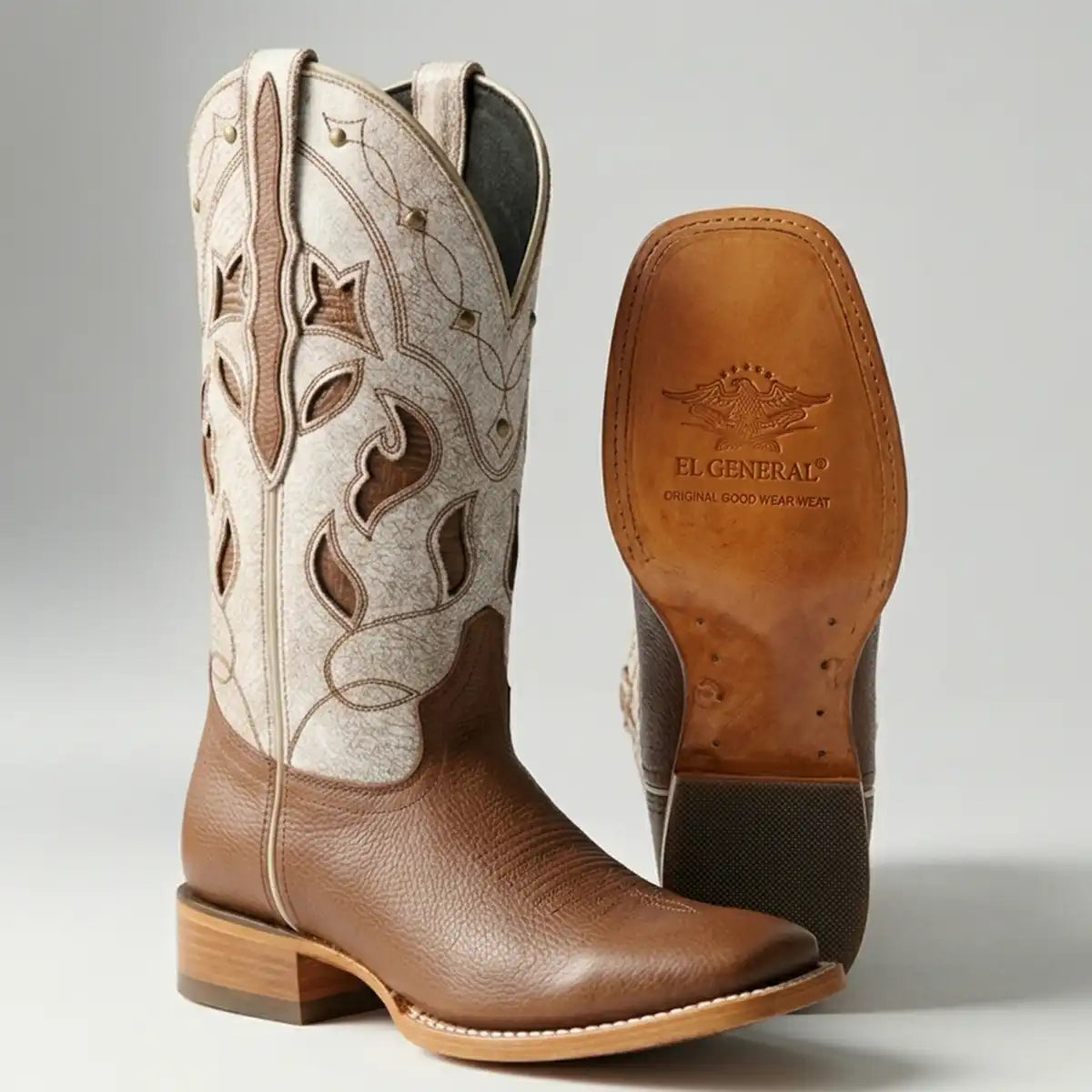 Studio shot of El General Women's Honey Brown Floter leather cowboy boot with a bone-colored embroidered shaft and wide square toe with leather sole.
