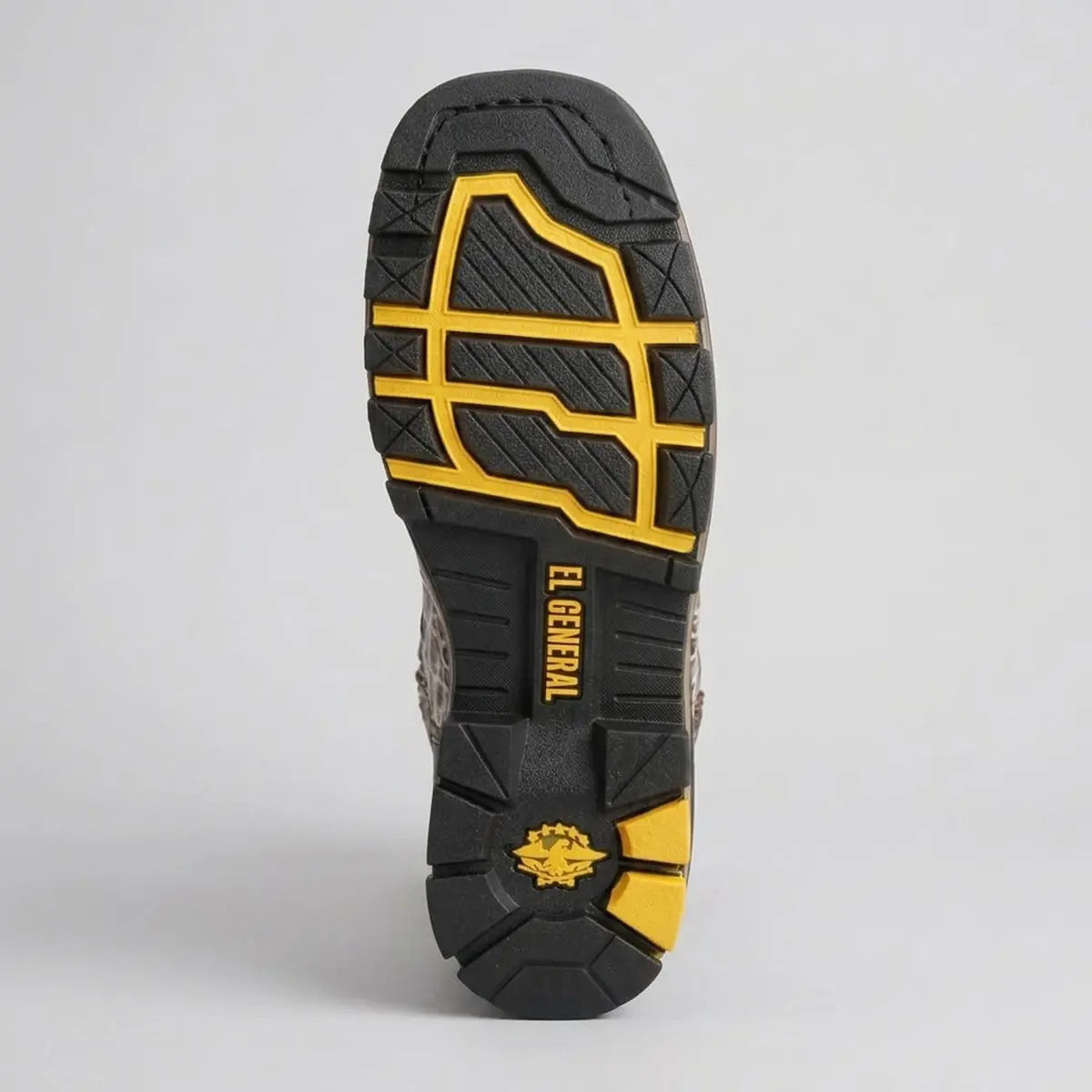 Bottom view of the El General heavy-duty rubber tractor work sole highlighting the high-traction yellow and black lug tread pattern.