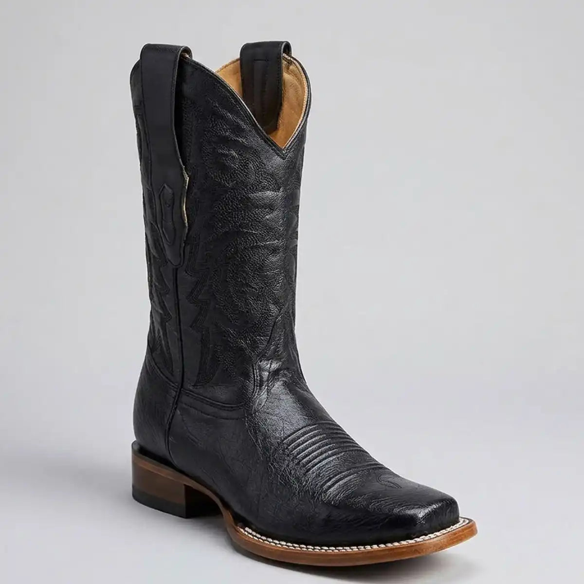 Three-quarter studio shot of the Los Altos men's black smooth ostrich belly square toe boot highlighting the smooth vamp finish.