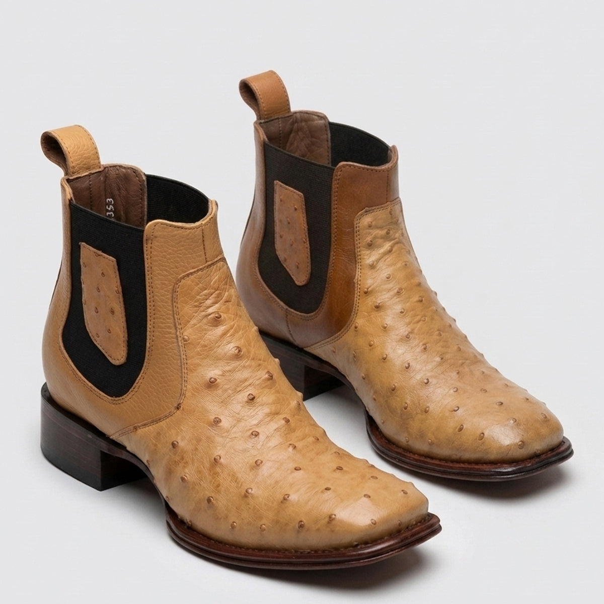 Los Altos men's tan antique saddle genuine full quill ostrich leather Chelsea ankle boots featuring a square toe, black elastic side goring, and a leather pull tab.