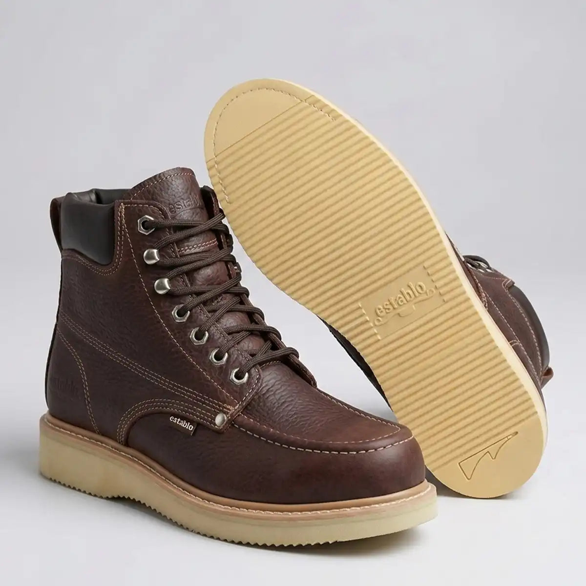 Sole and boot view of the Establo Men's steel toe work boot displaying the cream polyurethane ribbed wedge outsole.