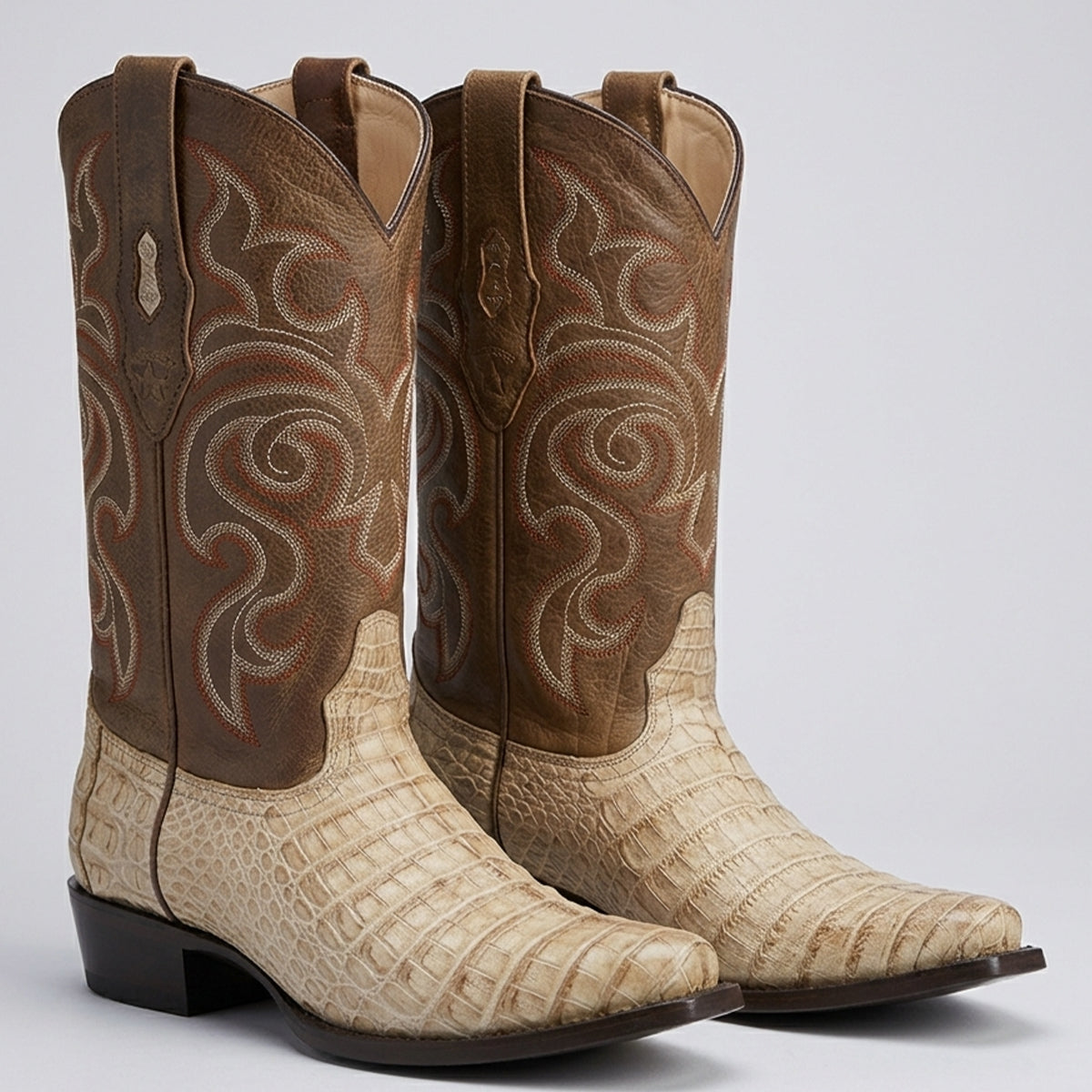 Los Altos men's beige caiman belly cowboy boots with brown leather shafts featuring intricate scroll embroidery, shown against a light gray background.