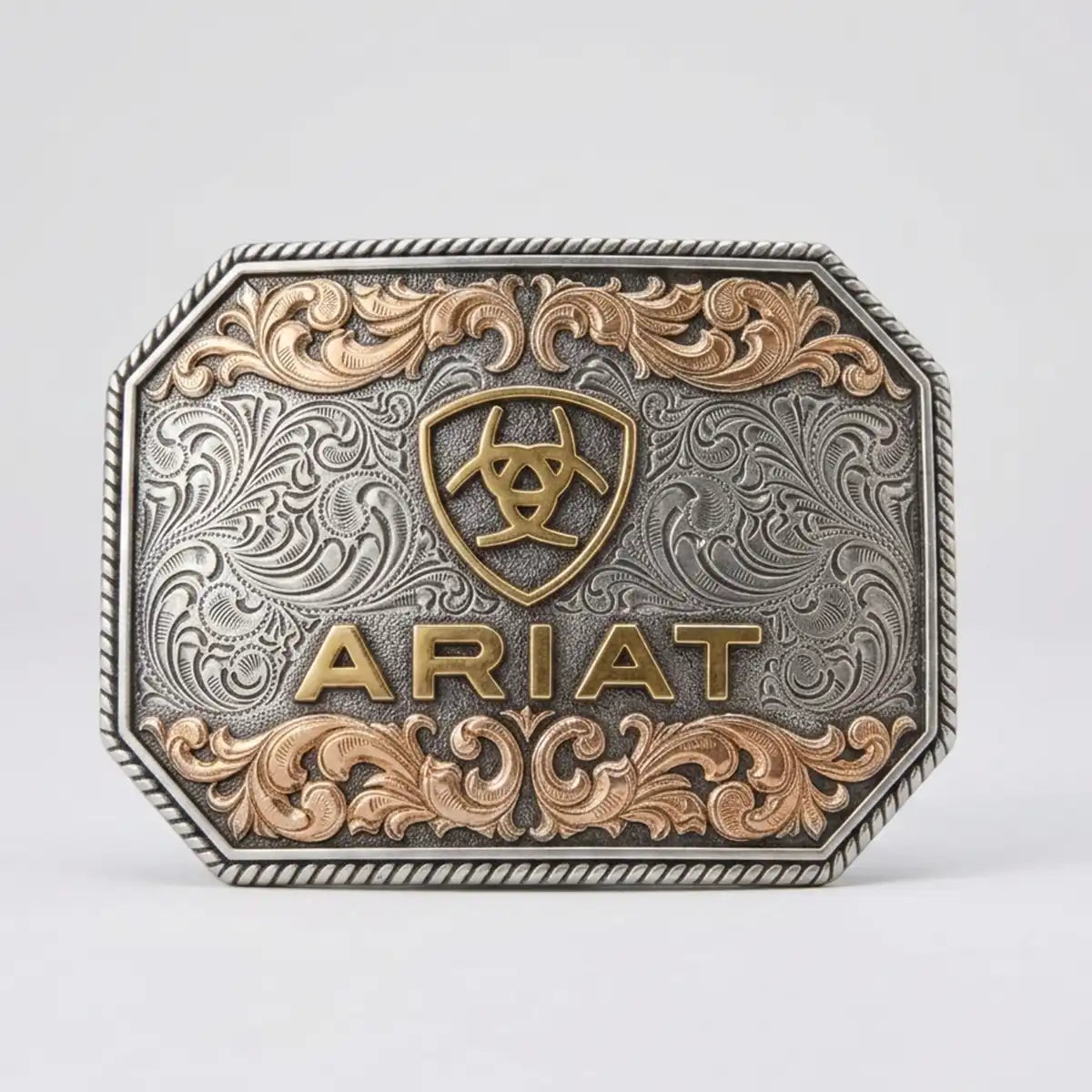 Ariat rectangular Western belt buckle by M&F Western with antique silver floral engraving, copper accents, rope edge, and raised gold logo.