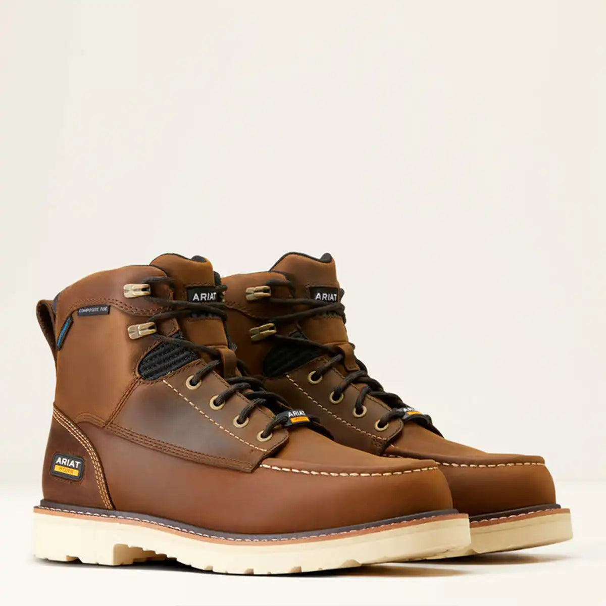 Three-quarter pair view of the Ariat Men's Rebar Lift 6" brown waterproof composite toe work boots showing the moc toe stitching and cream outsole.