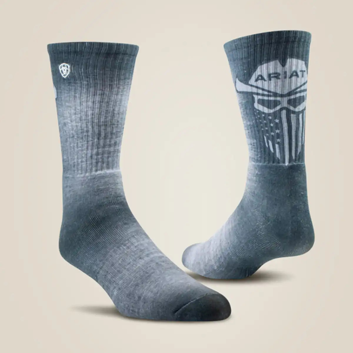 Pair of Ariat men's Incognito heathered grey/green graphic crew work socks showcasing the cowboy skull print on one sock and the embroidered white shield logo on the side of the other.