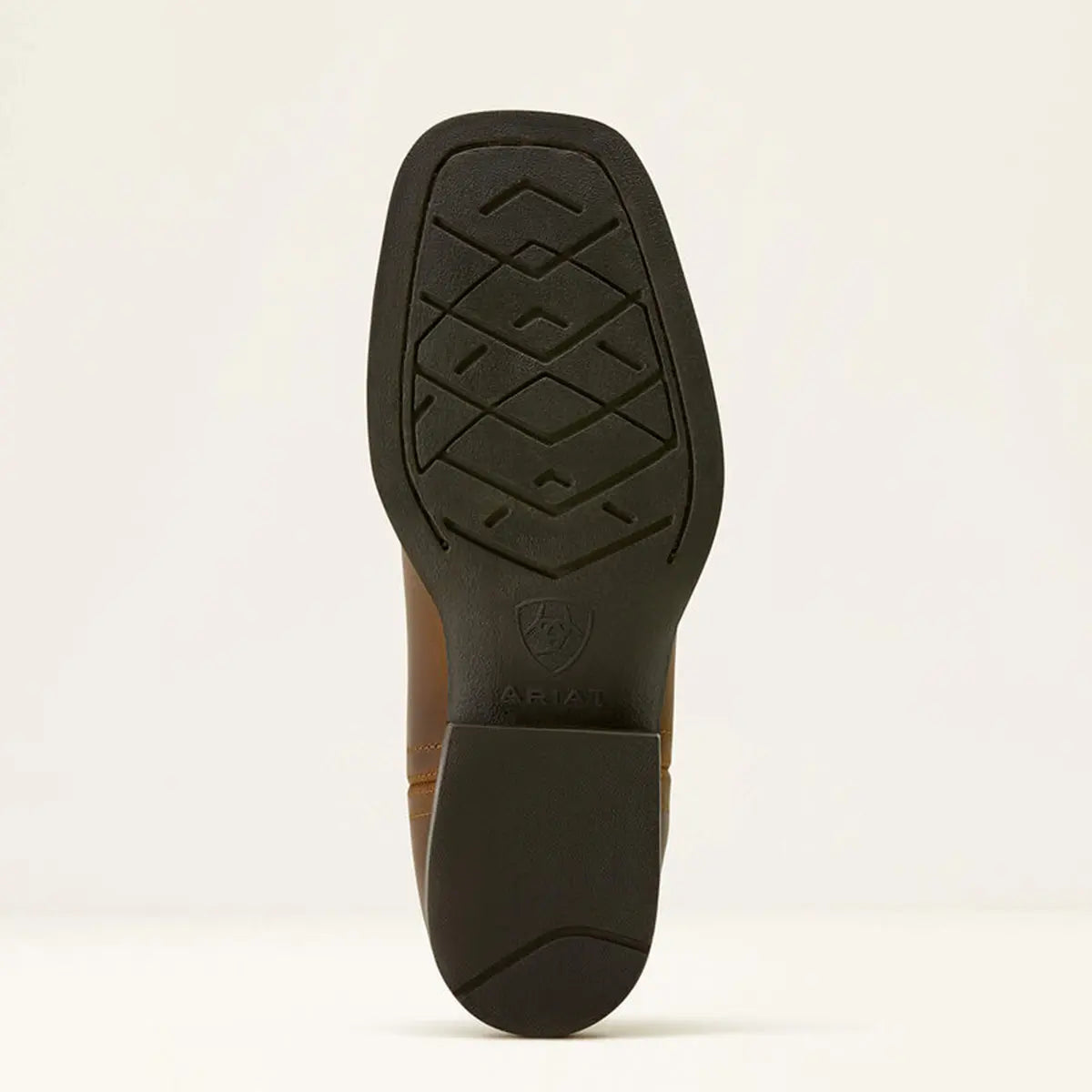 Bottom view of the dark flexible outsole tread pattern with embedded Ariat logo shield.