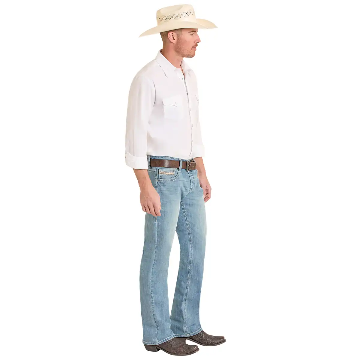A man shown in profile wearing a cream cowboy hat, a white long-sleeve button-up shirt, light blue jeans, a brown belt, and brown boots against a plain white background.