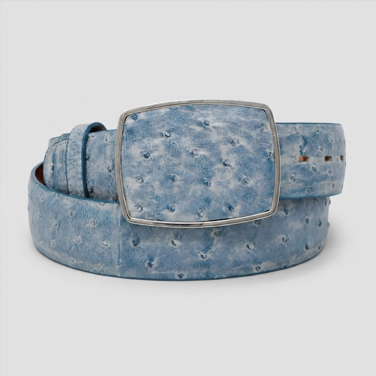 Los Altos light blue ostrich leather belt with a silver-tone rectangular buckle, coiled on a light gray background.