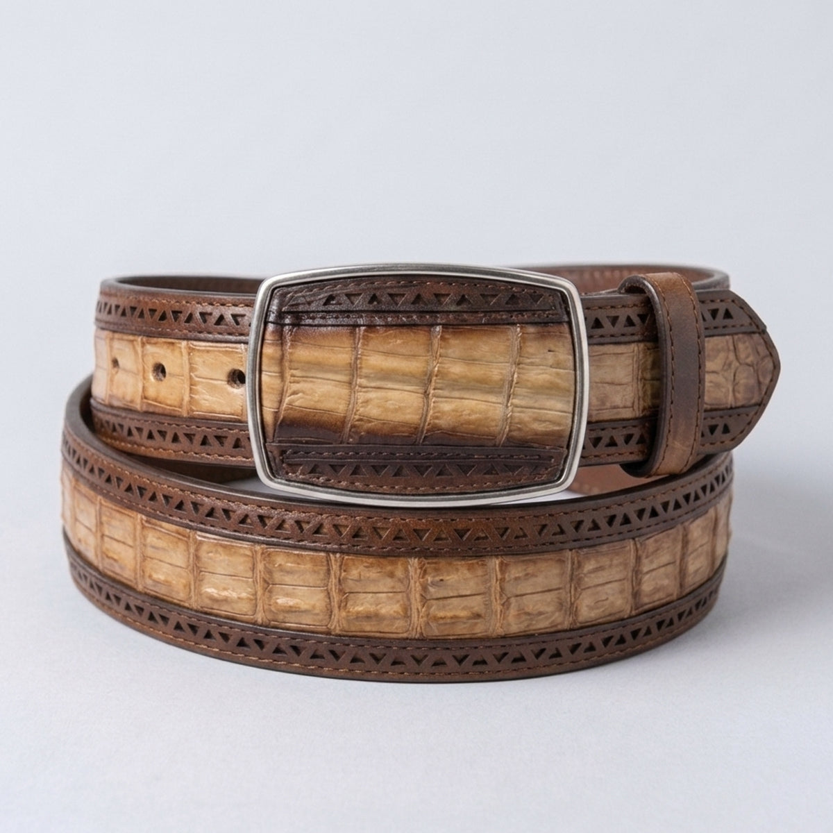 Shop the Los Altos men's exotic belt in Faded Oryx caiman belly leather. Features warm brown geometric laser-cut borders and a matching square inlay buckle.