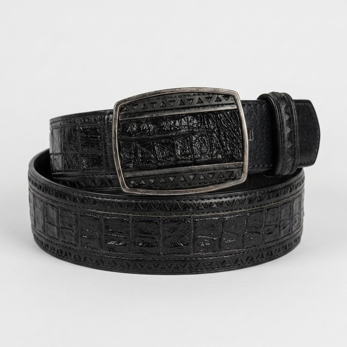 Los Altos men's black genuine caiman belly leather belt featuring a laser-cut geometric triangle border and a matching textured inlay buckle.