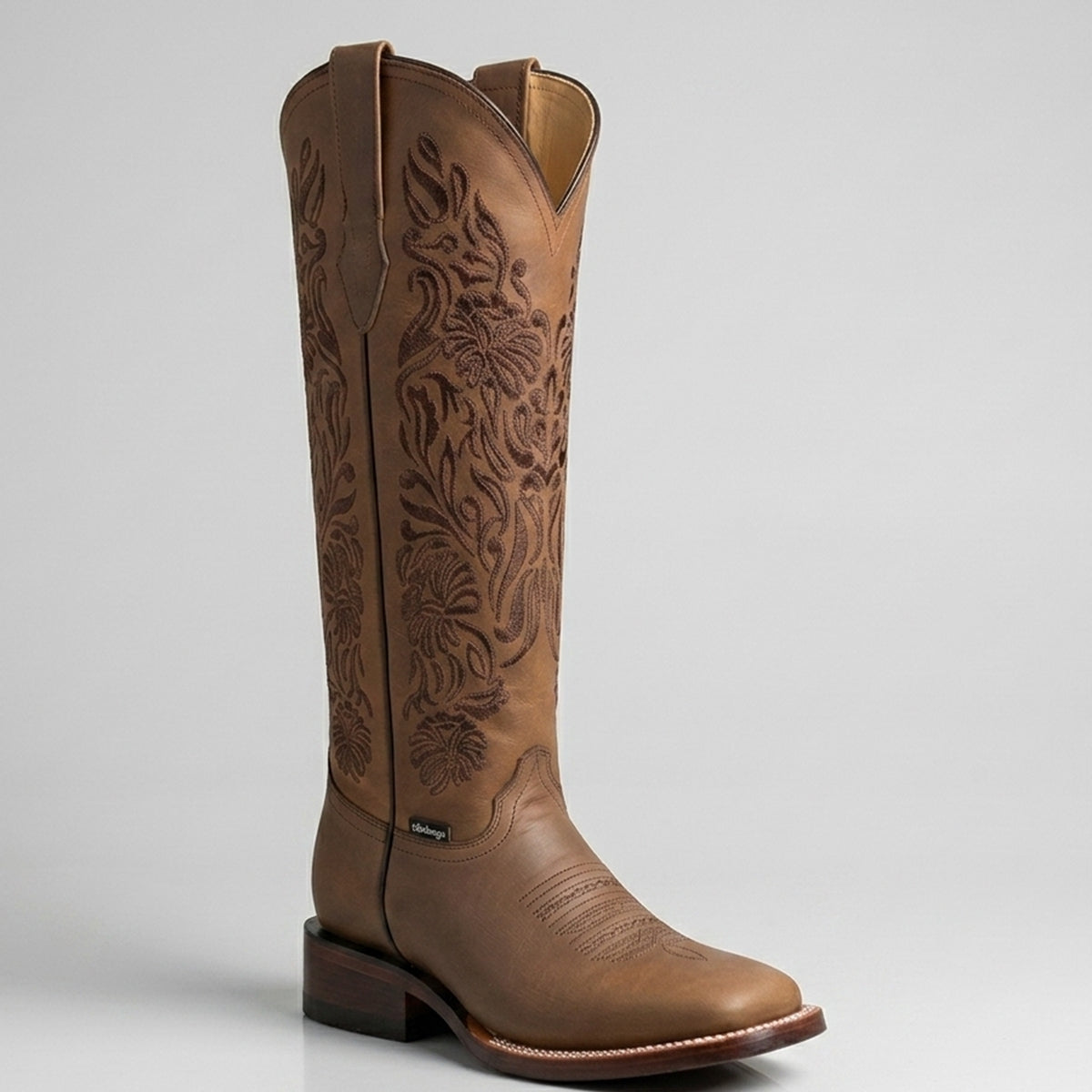 Botas Doble R women's Valencia 16-inch tall brown leather square toe cowgirl boot featuring dark tonal floral embroidery along the extended shaft.