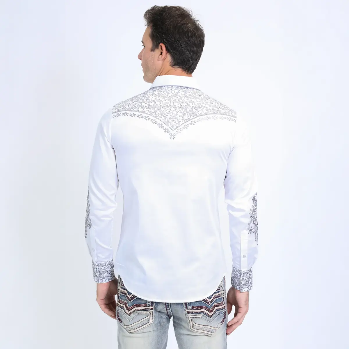 Rear studio view of the male model displaying the full grey tapestry scroll embroidery on the back Western V-yoke of the Platini white shirt.