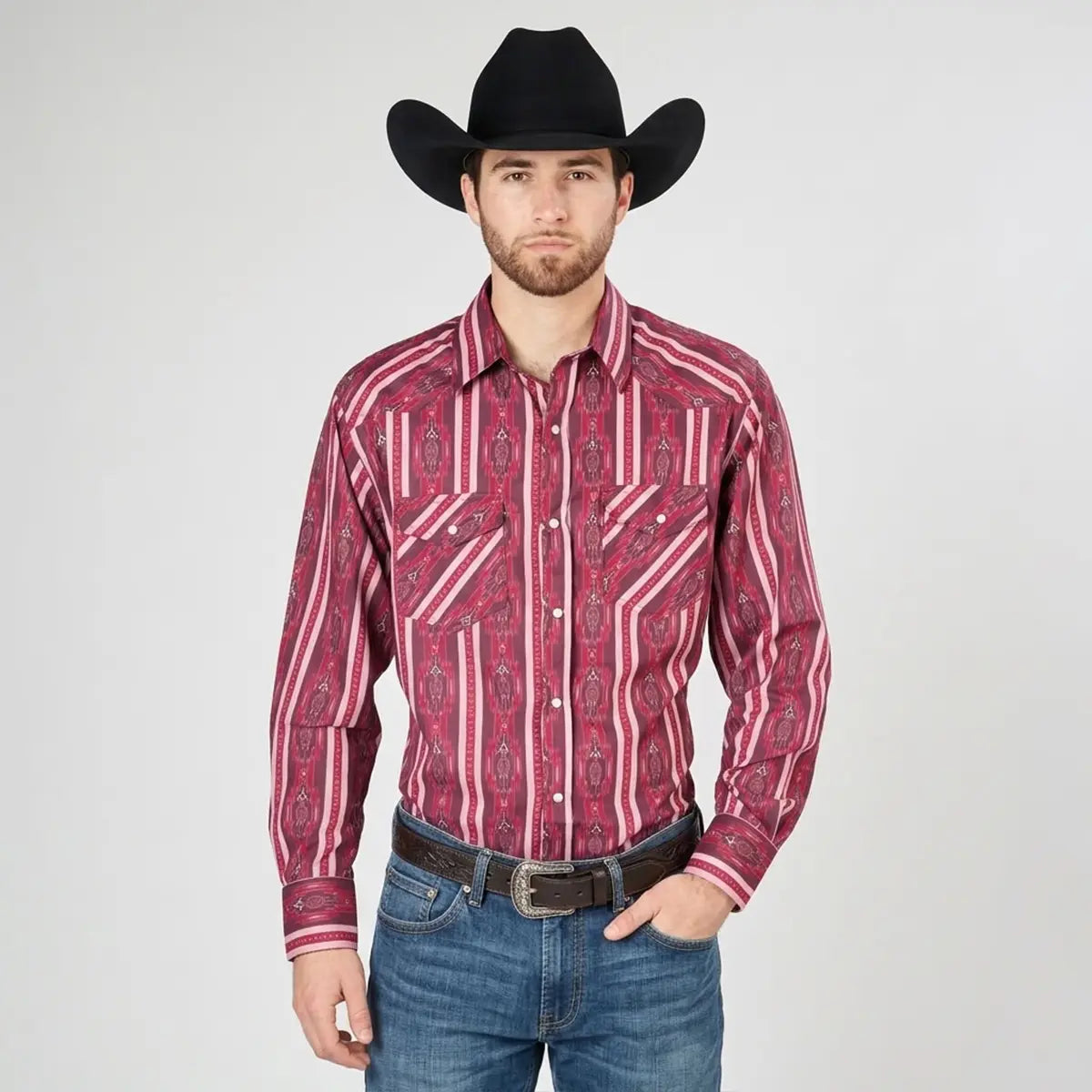 Front view of a male model wearing the El Señor de los Cielos by El General red and burgundy Aztec print Western shirt with black cowboy hat and Western belt.