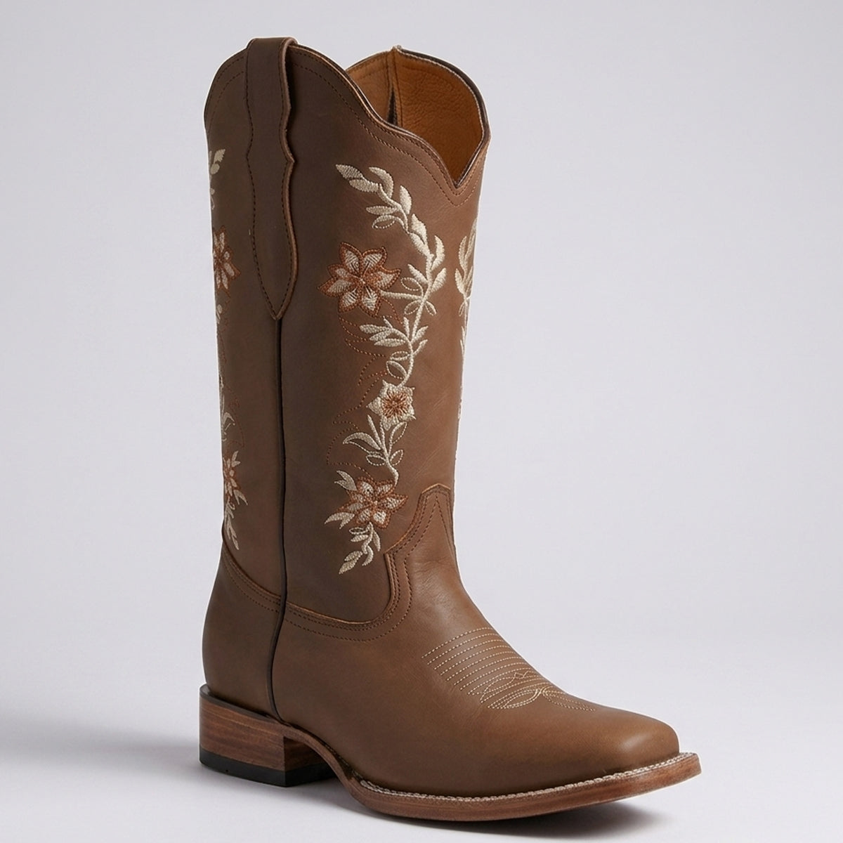 La Sierra women's brown leather cowboy boot with floral embroidery on the shaft, shown from a three-quarters angle against a light gray background.